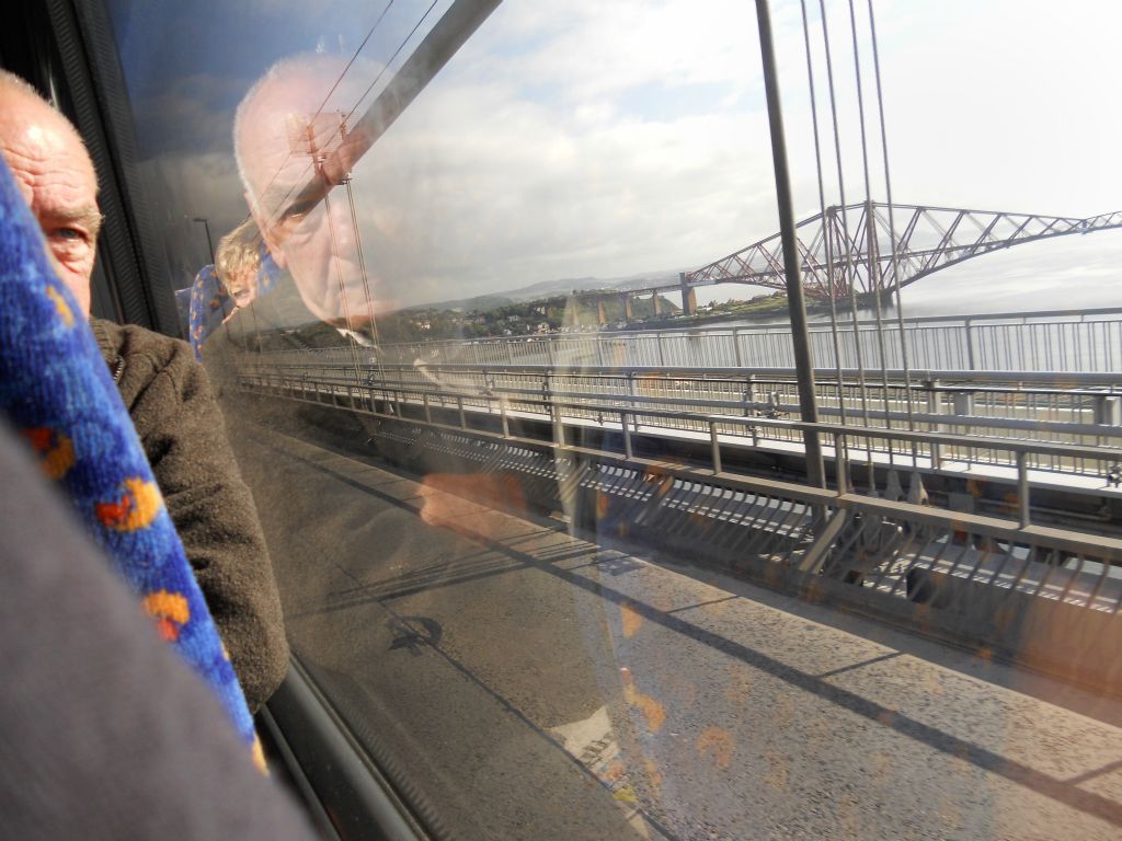 A reflected portrait from one forth bridge to the other.