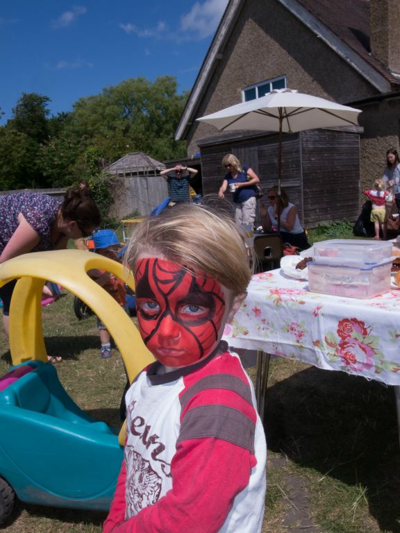 Spiderman face paint at fete.