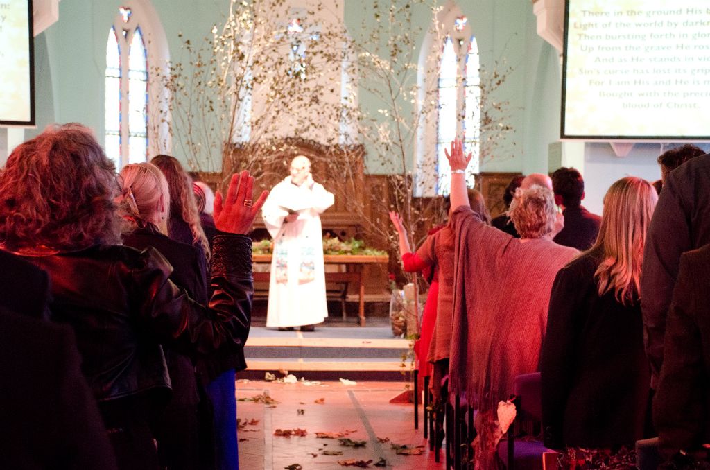 People pray in St Bartholomew's Church in Brighton.